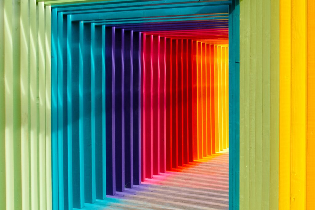 A rainbow colored covered walkway and corridor representing accessibility