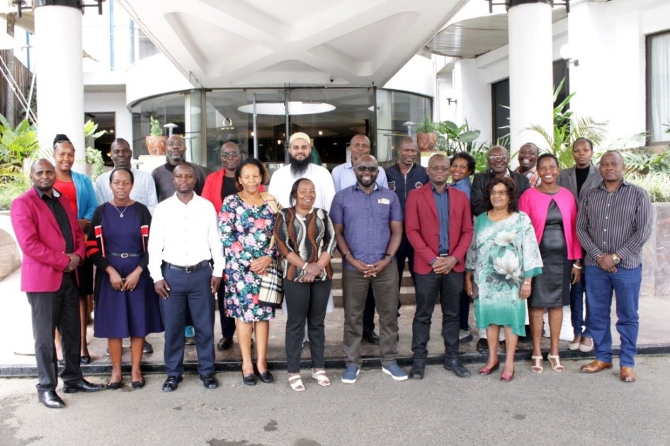 Group of people posing together.